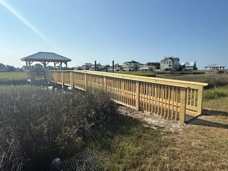 Timber walkway and covered pierhead at Salt Marsh Cove HOA