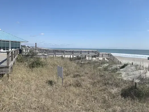 Wide view of the Litchfield by the Sea deck, dune walkway and stairs down to the beach