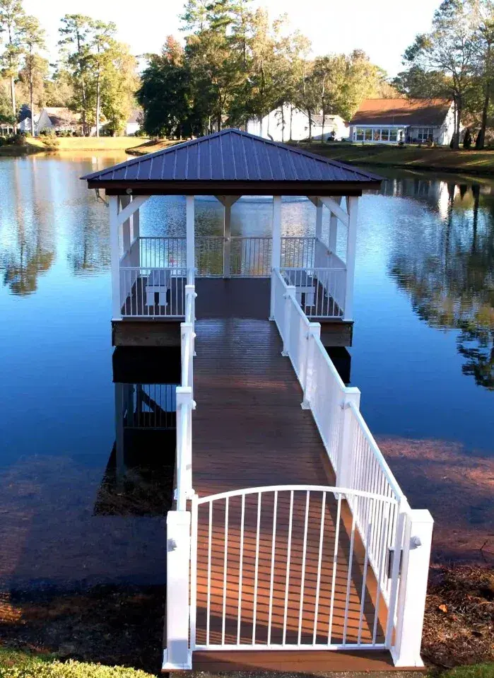 Covered pierhead and timber walkway beside the water at Blackmoor
